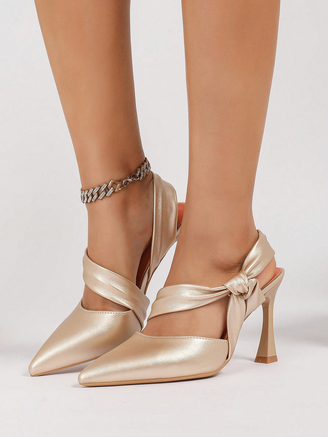 Step out in style with our Chic Elegance: Champagne Bow-Detail Pointed High Heeled Sandals! Designed for every occasion, these sandals combine elegance and comfort with their pointed design and high heel. The champagne bow-detail adds a touch of glamour, making you stand out from the crowd. Perfect for any fashion-forward individual!