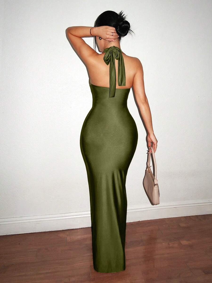 Turn heads at your next celebration in this stunning halter neck bodycon dress. The sleek silhouette hugs your curves in all the right ways, while the dramatic hollow cutout details add an unexpected edge. Perfect for New Year's Eve, holiday parties, or any occasion calling for show-stopping style. The flowing maxi length keeps things elegant and sophisticated, making this your go-to dress for making an unforgettable entrance.