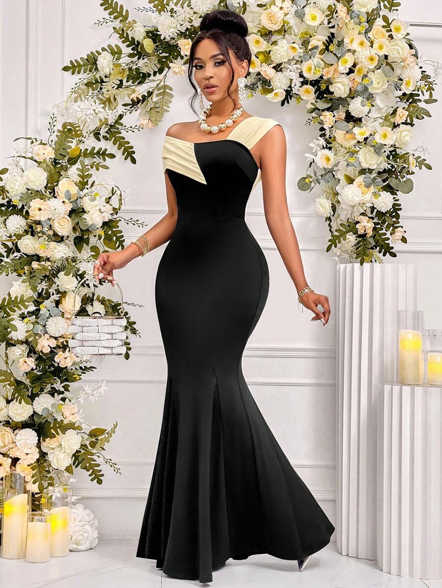 Make a statement at your next special occasion in this stunning high-waisted asymmetrical fishtail skirt dress. The dramatic silhouette features an elegant fishtail hem that catches light and movement, while the high waistline creates a flattering, elongated look. Perfect for weddings, galas, and unforgettable nights out, this dress combines sophisticated design with playful flair. The asymmetrical cut adds modern edge to timeless elegance, ensuring you'll turn heads and feel absolutely fabulous from the mo