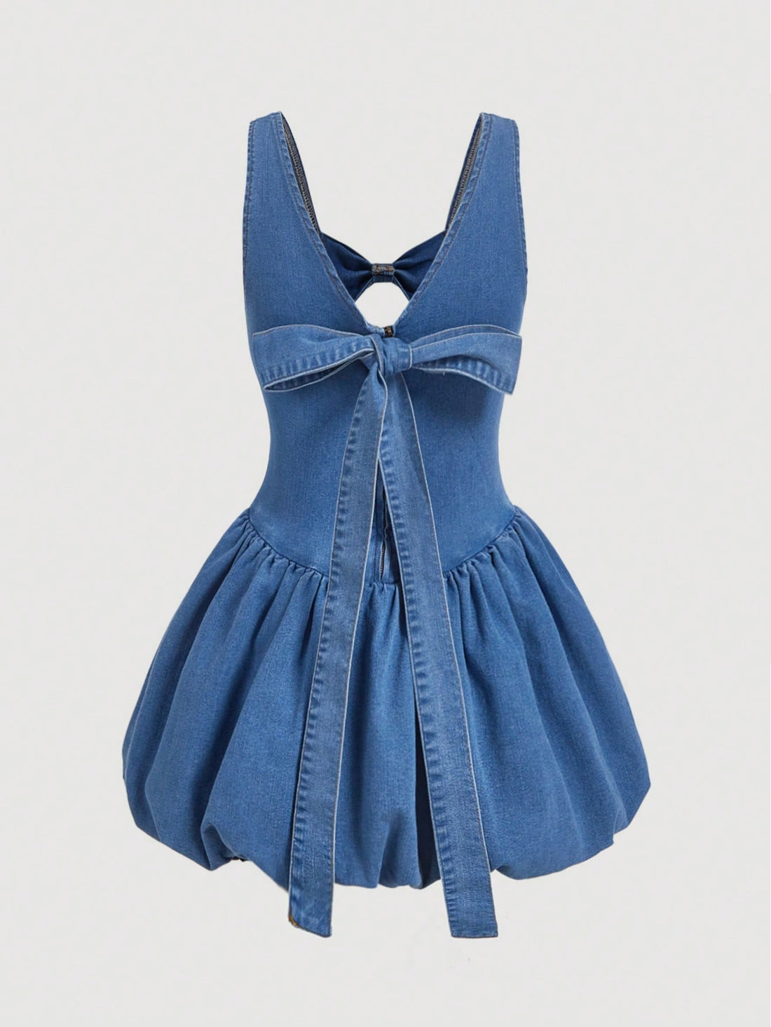 Feel effortlessly chic in this Casual Tulip Hem Denim Dress! The playful bow detail adds a touch of whimsy to this stylish piece. Perfect for any casual occasion, this dress is sure to become a staple in your wardrobe. (No need to be serious, it's just a dress!)