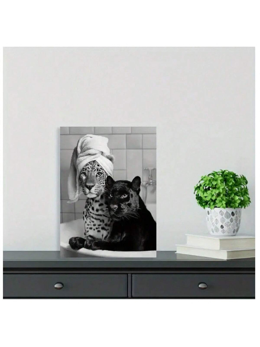 Bring a touch of whimsy to your space with this charming black and white vintage art print featuring playful leopard and panther cubs in a bathtub. Perfect for adding personality to your living room, bathroom, or bedroom, this unframed canvas print blends nostalgic style with a fun, lighthearted vibe. Its timeless design makes it a delightful conversation starter and a unique way to brighten any room.
