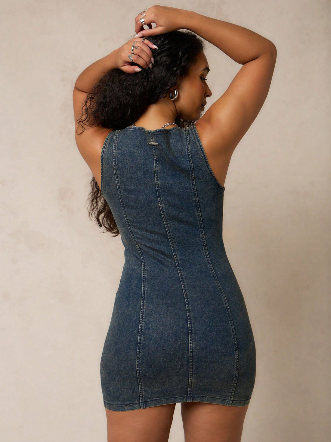 Step out in style with this chic western lace-up washed denim mini dress! Perfect for any occasion, this dress effortlessly combines fashion and comfort. Turn heads and make a statement with this trendy piece.