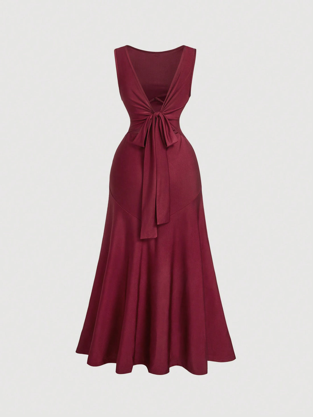This stunning wine red evening dress is backless and features a unique bow tie detail, adding an elegant touch to any event. The open back design adds a touch of allure while the bow tie detail adds a playful touch. Perfect for a night out or special occasion.