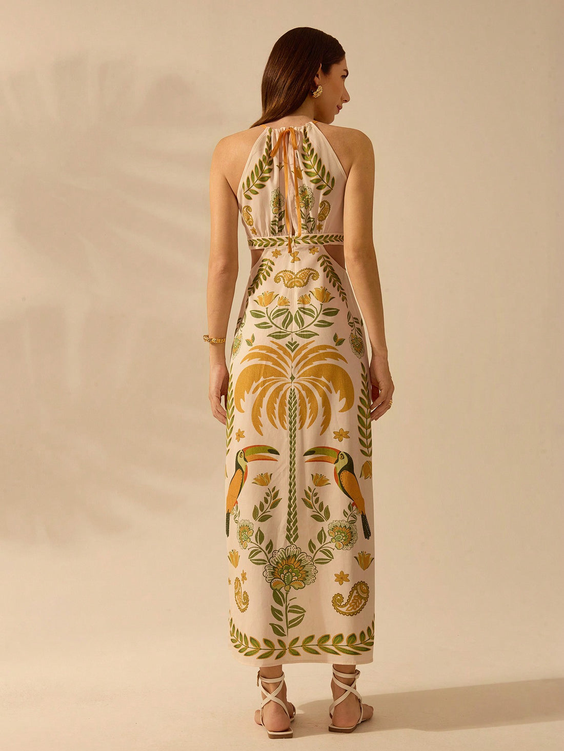 Get ready for a tropical adventure in our Boho Tropical Paradise Halterneck Dress! With a vibrant Rhododendron and Toucan print, you'll stand out while staying cool and comfortable. Perfect for summer fun and relaxation.