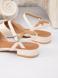 Rear sole detail of white PU leather slingback flats showing low block heel construction