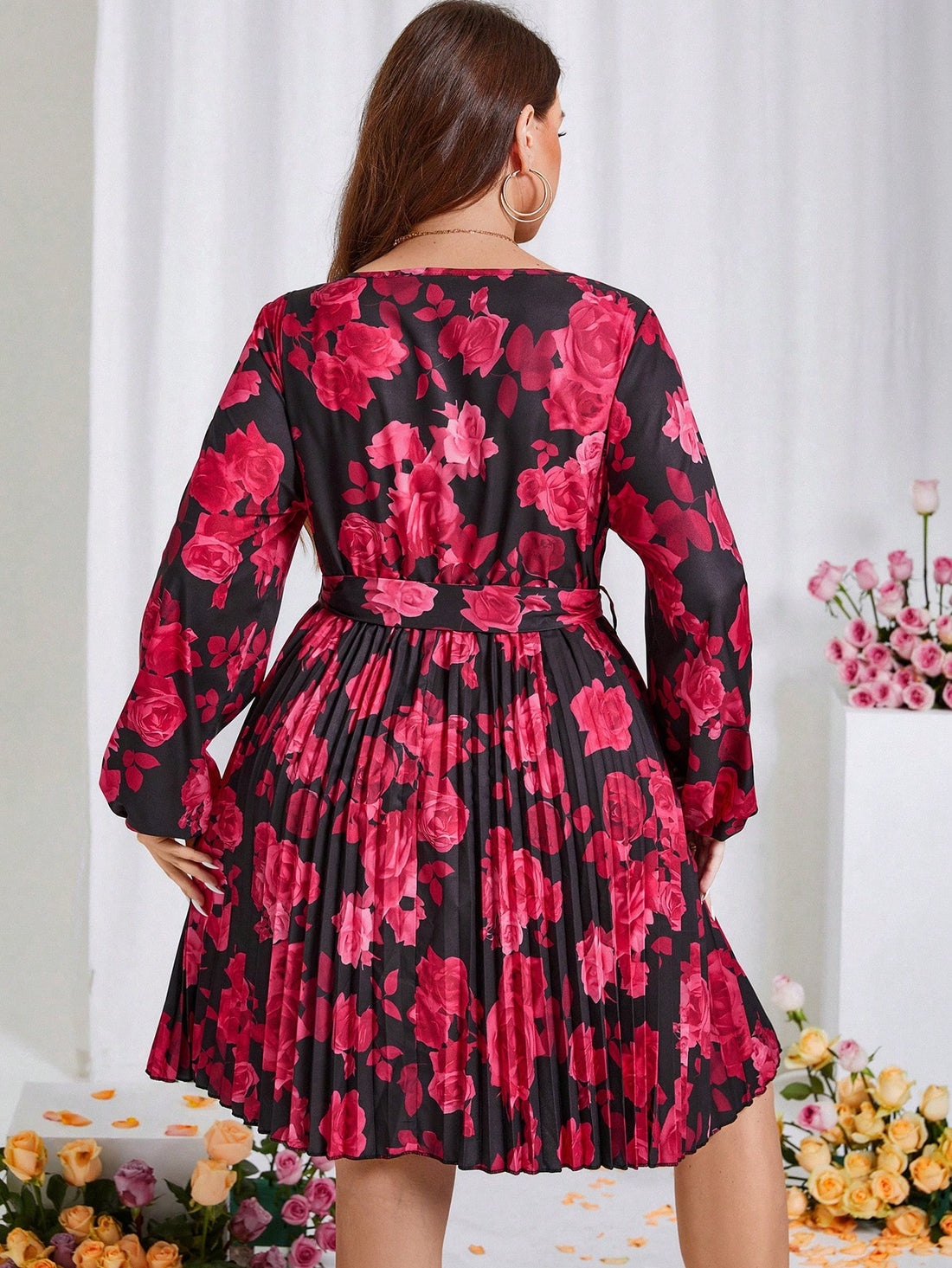 Get ready to turn heads in this Chic Plus Size Floral Pleated Dress! With a flattering belted waist and beautiful floral print, this dress is perfect for the spring season and even doubles as a great Valentine's Day outfit. Don't miss out on this must-have addition to your wardrobe.