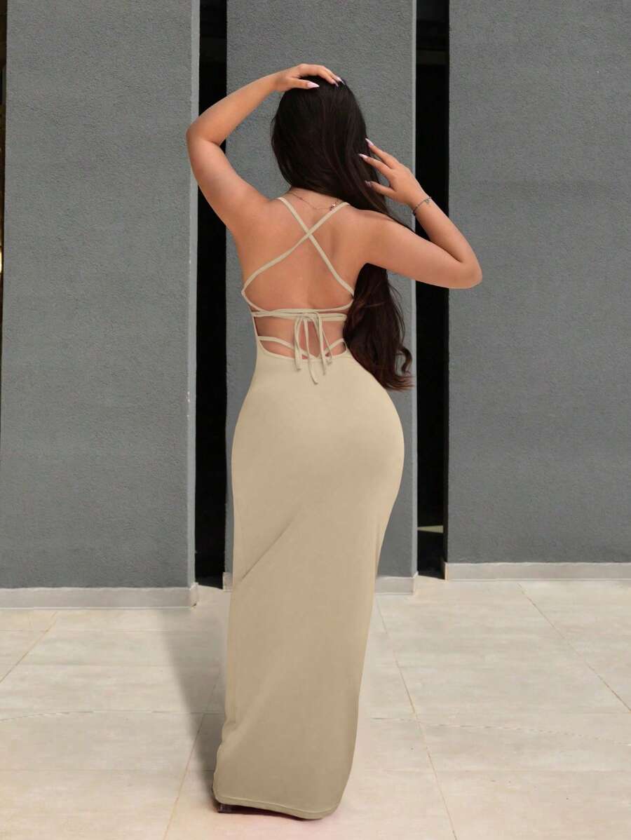 Slip into something effortlessly chic with this backless beauty. The fitted silhouette hugs you in all the right places, while the tie-up back detail adds a flirty, unexpected twist. Perfect for date nights, summer soirées, or whenever you want to turn heads without trying too hard. Available in timeless solid colors that work with everything in your closet. Simple, sexy, and oh-so-versatile.