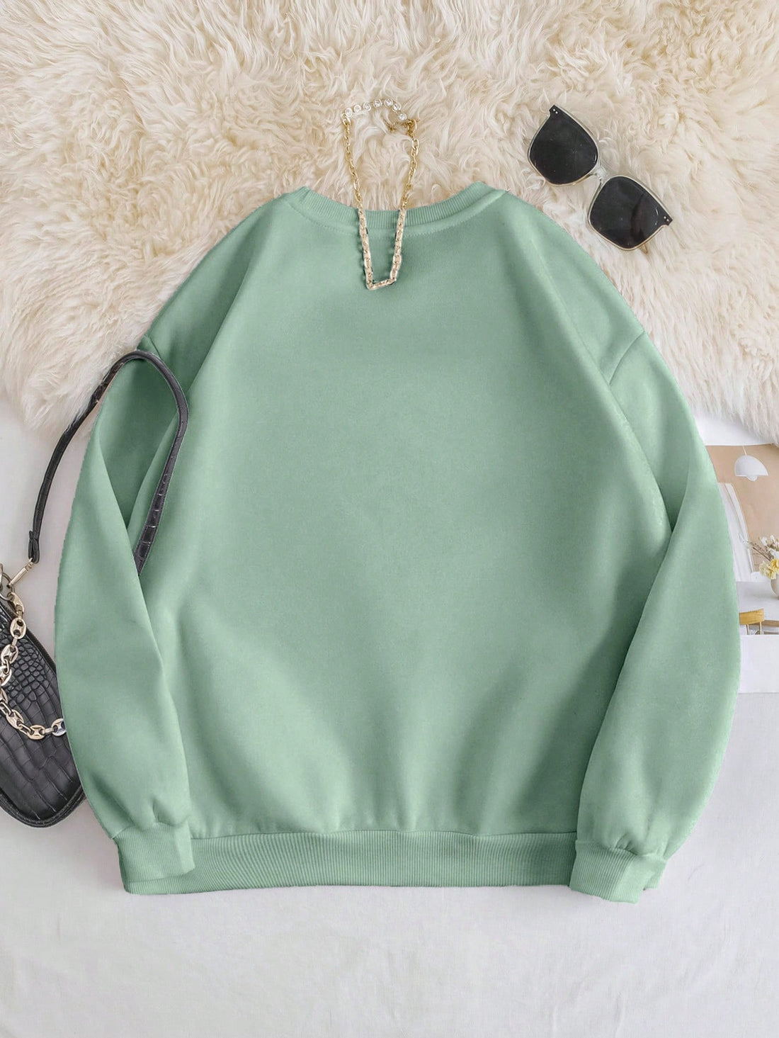 Stay cozy and cute on Valentine's Day with our Adorable Cat Heart Pullover Sweatshirt. The meow-tastic design will surely melt hearts. Get ready to receive compliments galore!