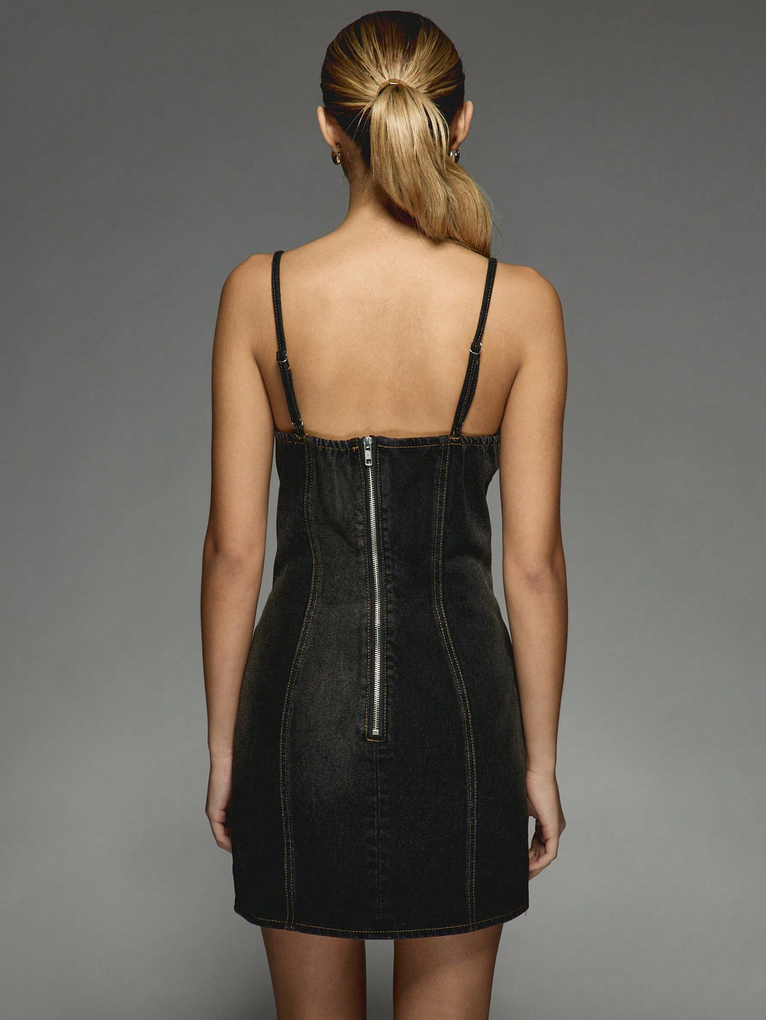 Step into the spotlight with this Y2K-inspired denim mini dress, sparkling with gold studs and featuring a whimsical butterfly bodice. Perfect for cocktail parties and club nights, it blends edgy style with playful charm to keep you dancing all night long.