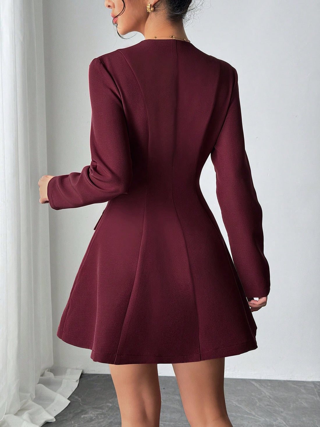 Effortlessly chic meets wonderfully wearable in this minimalist long-sleeve dress. The notched neckline adds a modern touch, while strategic cinching flatters your silhouette without trying too hard. Faux pockets keep the clean lines intact—because who doesn't love a dress that looks good and feels practical? Perfect for transitioning through fall in style, this piece pairs beautifully with sneakers or boots for an understated vibe that speaks volumes.