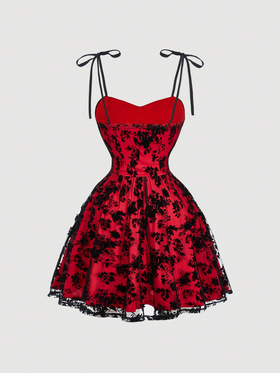 Step into summer with this playful plus size vintage-inspired black mesh mini dress. Delicate embroidered details and a charming bow at the cami neckline add a flirty touch, while the A-line silhouette ensures a comfortable, flattering fit. Perfect for sunny days and stylish nights, this dress brings effortless fun to your warm-weather wardrobe.