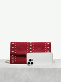 Close-up view of elegant riveted angola red clutch: perfect fashion accessory for valentine's day with riveted accents, clutch silhouette for party styling