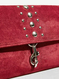 Close-up view of elegant riveted angola red clutch: perfect fashion accessory for valentine's day with riveted accents, clutch silhouette for party styling