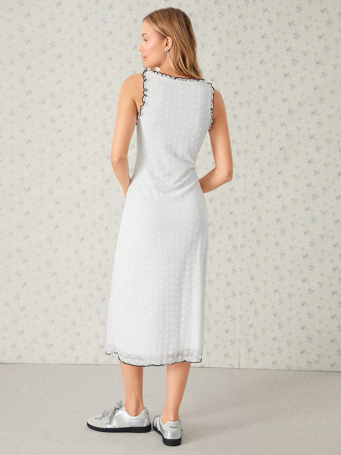 Step out in style with this playful yet elegant dress featuring delicate white lace and bold black color block accents. The ruffled V-neck adds a flirty touch, perfectly balancing sweet charm with a sexy edge. Ideal for turning heads at any event, this dress combines comfort and confidence effortlessly.