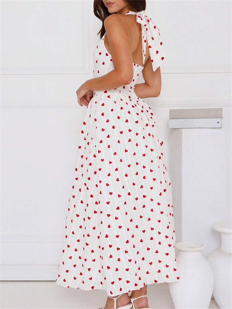 Get ready to turn heads in this Chic Summer A-Line Dress! With a trendy heart print and a playful tie-up halter neck, this dress is perfect for any summer occasion. Its flowy A-line cut will keep you cool and comfortable, while its flattering silhouette will make you feel confident and stylish. Don't be surprised if you receive compliments all day long!