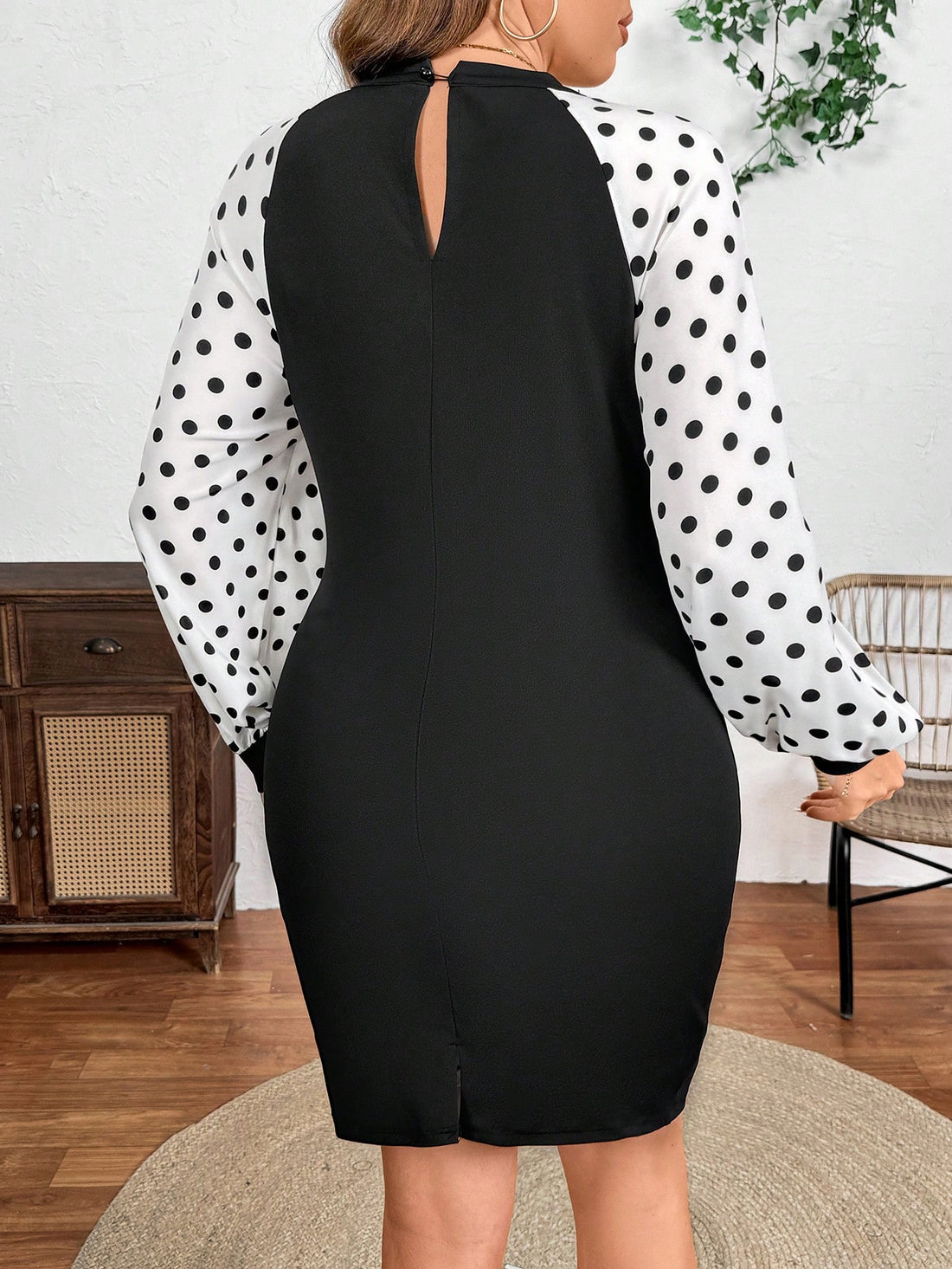Be the belle of the ball in this playful Chic Plus Size Polka Dot Lantern Sleeve Dress! The adorable bow detail adds a charming touch to the flowy lantern sleeves. Perfect for any occasion, this dress is sure to turn heads and make you feel confident and stylish. (Plus size and polka dots - what more could you want?!)