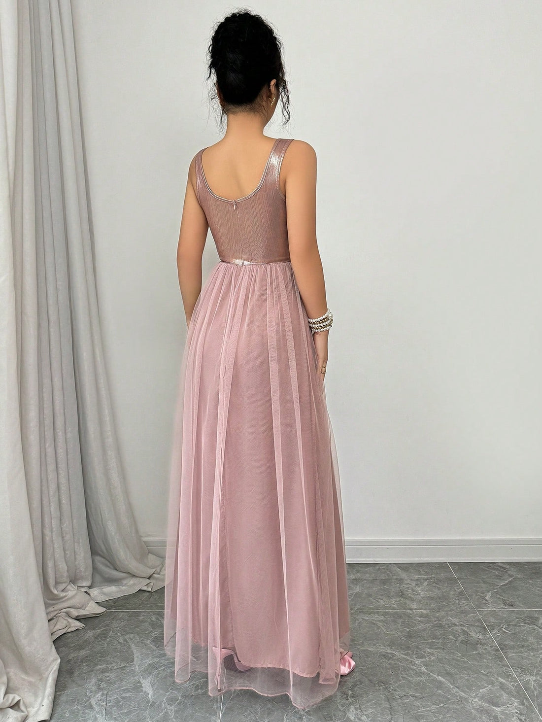 Turn heads effortlessly in this Elegant V-Neck Sleeveless Mesh Dress. Its airy mesh fabric keeps you cool while the flattering V-neck adds a hint of allure. Perfect for everything from garden parties to evening outings, this dress blends comfort with style so you can dance, mingle, and shine all night long.