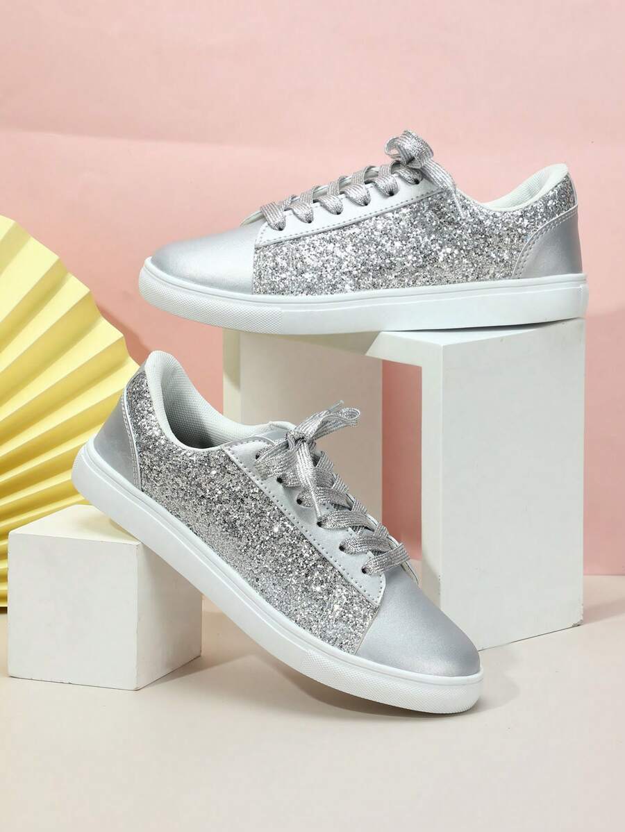 Step into style with these eye-catching pink sequin sneakers designed for women who refuse to compromise on comfort or flair. The shimmering sequin upper catches the light with every step, making them perfect for casual outings, weekend adventures, or adding sparkle to festive celebrations. Built with a supportive low-top silhouette, these athletic shoes feature cushioned insoles and flexible soles that keep your feet comfortable throughout the day.