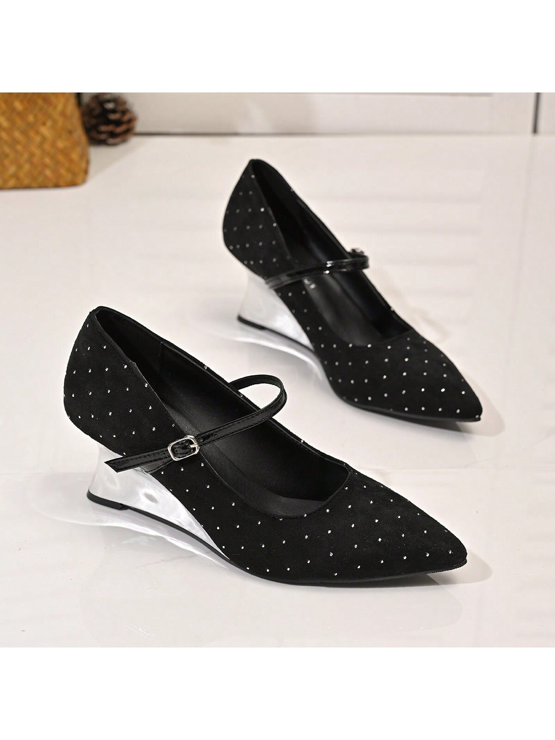 Introducing Chic Elegance: stylish, chic, and elegant. These women's black pointed toe wedge heels add a touch of sophistication to any outfit. With rivet detailing and an ankle strap, these heels are both trendy and comfortable. Elevate your look with Chic Elegance.