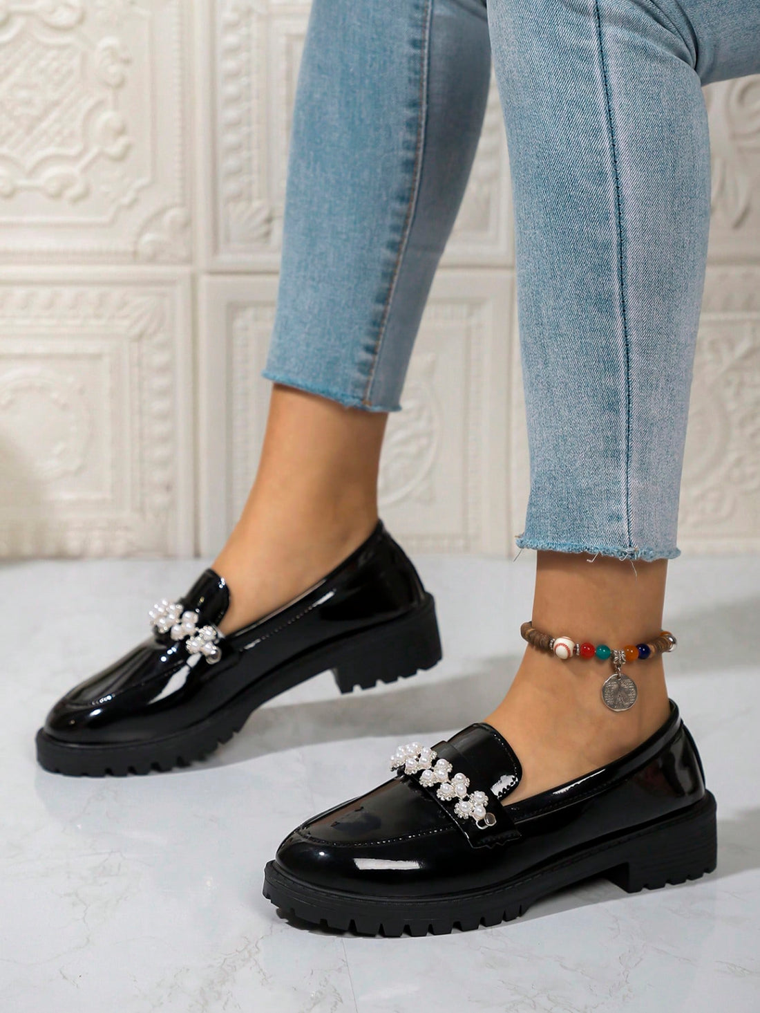 Step into style with our Chic Pearl-Embellished Chunky Platform Loafers! These trendy British shoes are perfect for Fall/Winter 2024. With a chunky platform and pearl accents, you'll be the talk of the town. Elevate any outfit with ease and stand out from the crowd. (Put your best foot forward with these cheeky loafers!)