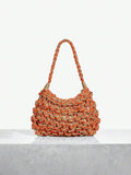 Brighten your beach days with this playful orange and gold crochet hobo bag. Lightweight and spacious, it’s perfect for carrying your sun essentials while adding a splash of vibrant style to your look. Its unique crochet design mixes casual charm with elegant shimmer, making it your go-to accessory for seaside adventures and sunny strolls.