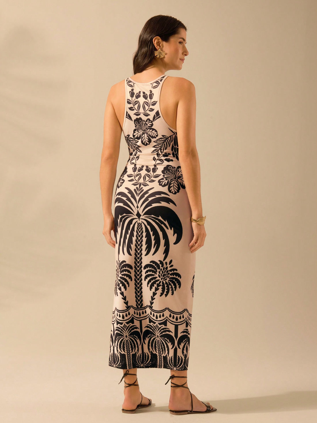 Get ready to feel like you're on a tropical vacation with our Bohemian Bliss dress! The sleeveless design and coconut tree print make it perfect for summer days. Soak up the sun in style and comfort. Smiles and good times sold separately.