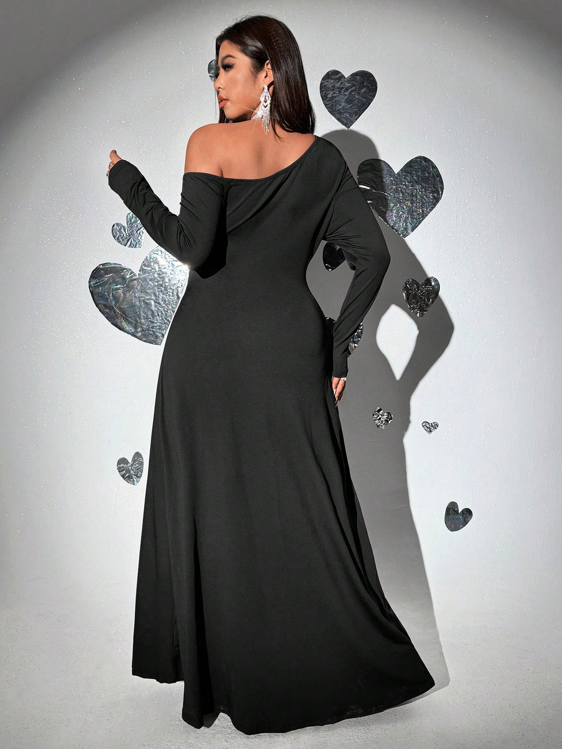 Celebrate love and style this Valentine's Day in our Elegant Plus Size Floral Party Dress. Featuring a flirty asymmetric neckline and a daring high slit, this dress combines comfort with a touch of drama. The vibrant floral pattern adds a playful charm, making it perfect for dancing the night away or stealing the spotlight at any party. Designed to flatter and empower, this dress ensures you feel confident and radiant all evening long.