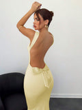 Pale yellow open back cowl neck maxi dress with bow