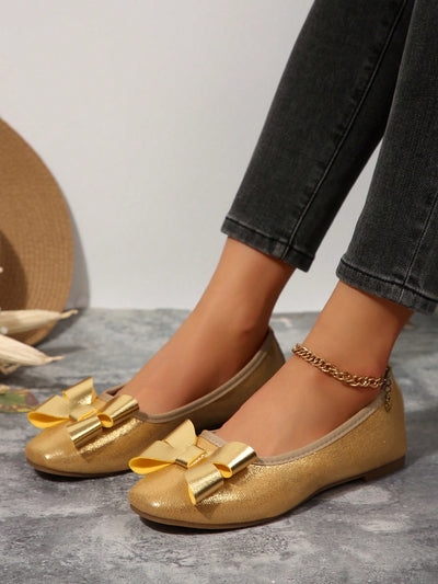 Chic Comfort: Women’s Gold Satin Loafers with Big Bow Detail