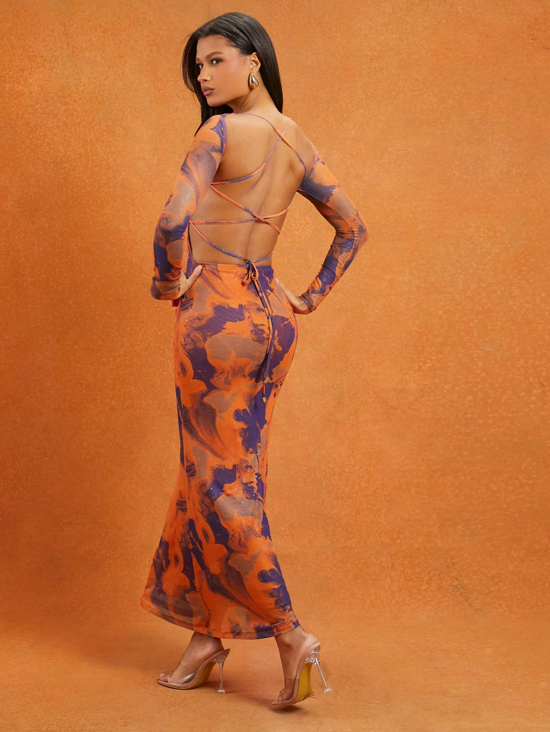 Step into vacation mode with this Chic Abstract Printed Maxi Dress! The flowing silhouette pairs perfectly with playful mesh details and a daring lace-up back, creating a breezy yet elegant look for sunny days and evening strolls. Embrace effortless style that’s bound to turn heads wherever your getaway takes you.