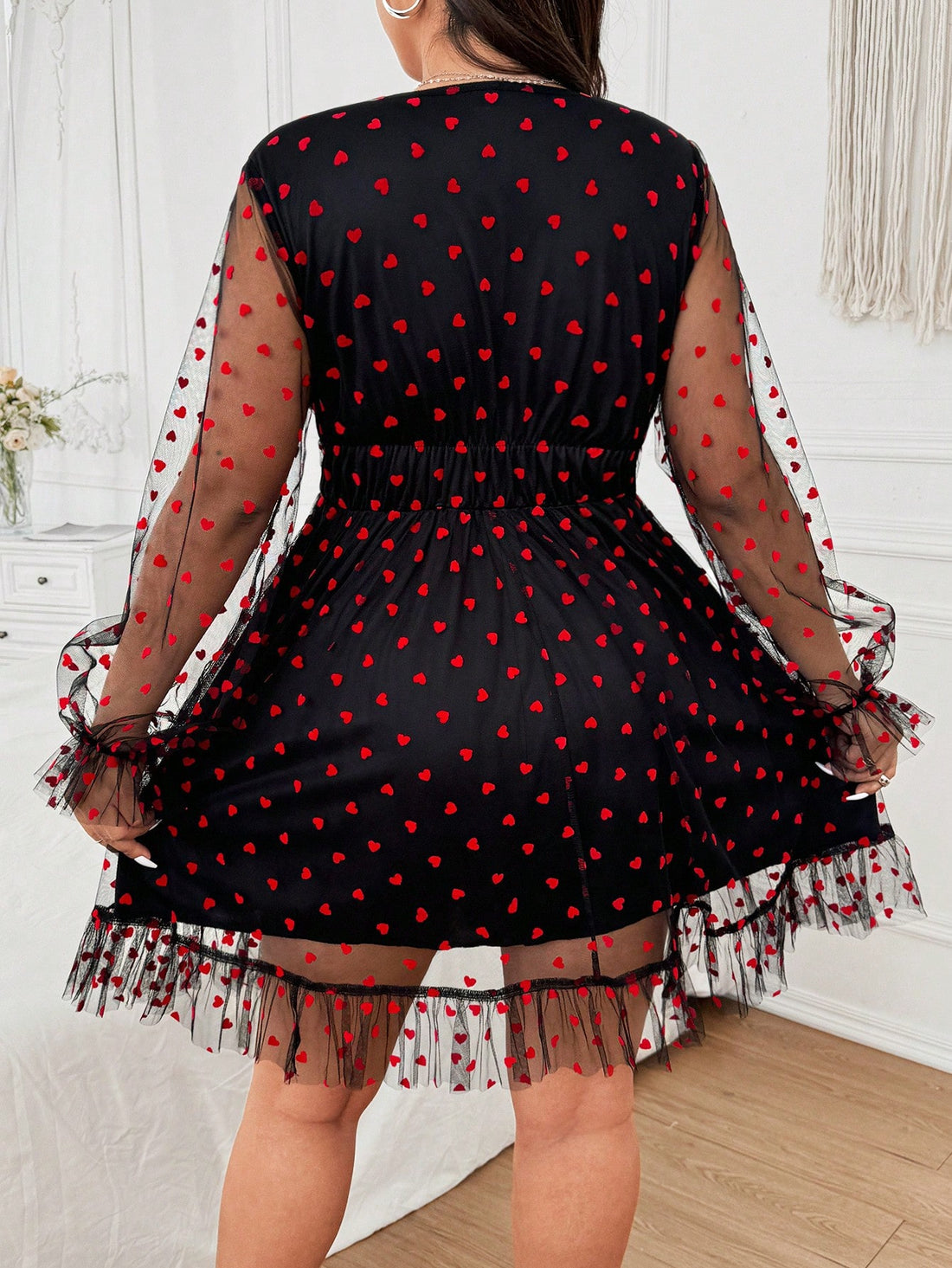Step up your Valentine's Day game with our Plus Size Flocked Heart Sheer Mesh V-Neck Dress. Featuring a flirty sheer mesh design and playful flocked hearts, this dress is perfect for adding a touch of romance to your holiday. Get ready to feel confident and fabulous all night long!