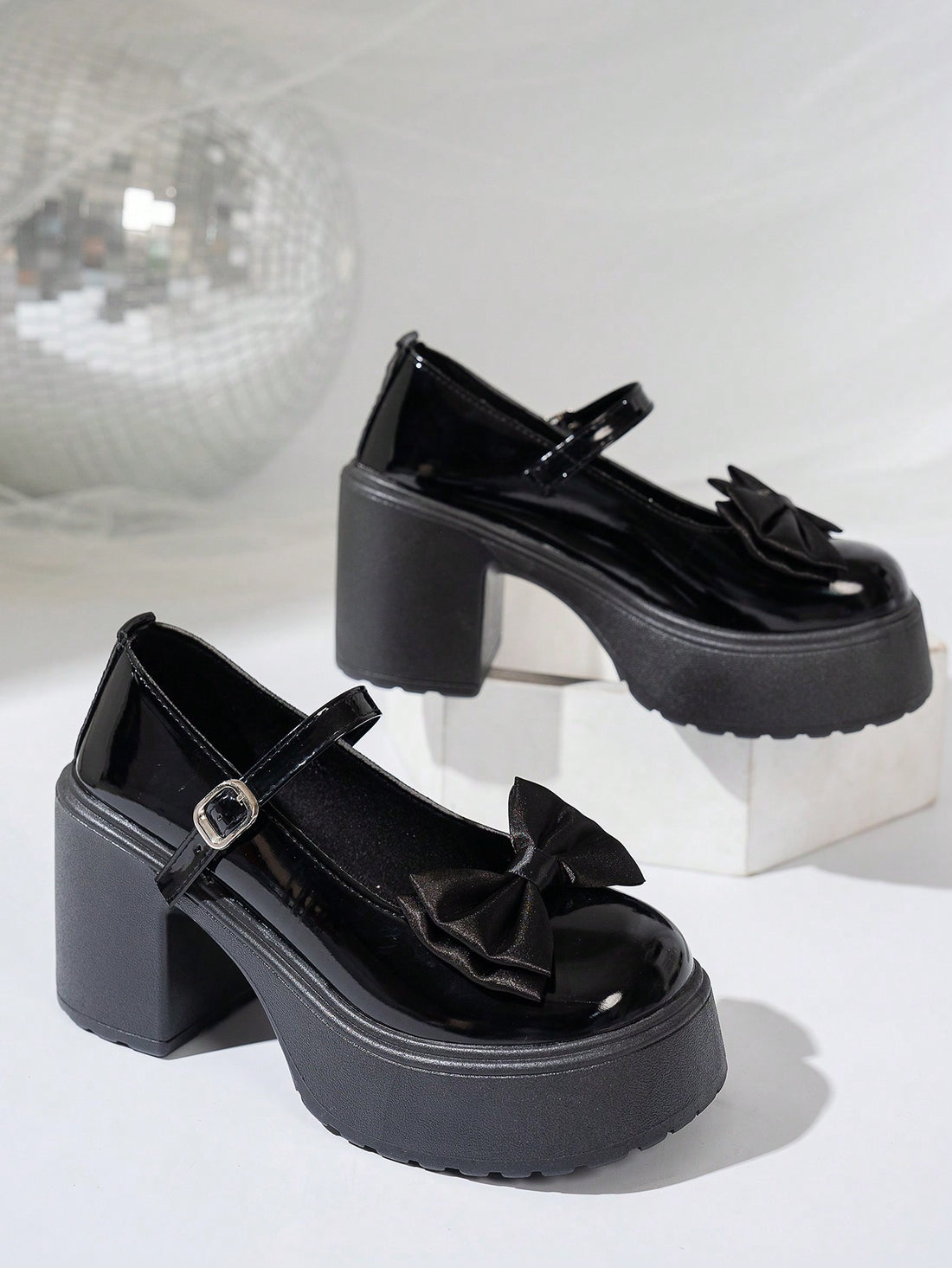 Elevate your style with these Chic Black Leather Mary Jane Heels. The cute bow tie and metal buckle add flair to any outfit. Perfect for any occasion, these heels are both fashionable and versatile. Elevate your shoe game with these unique and playful heels.