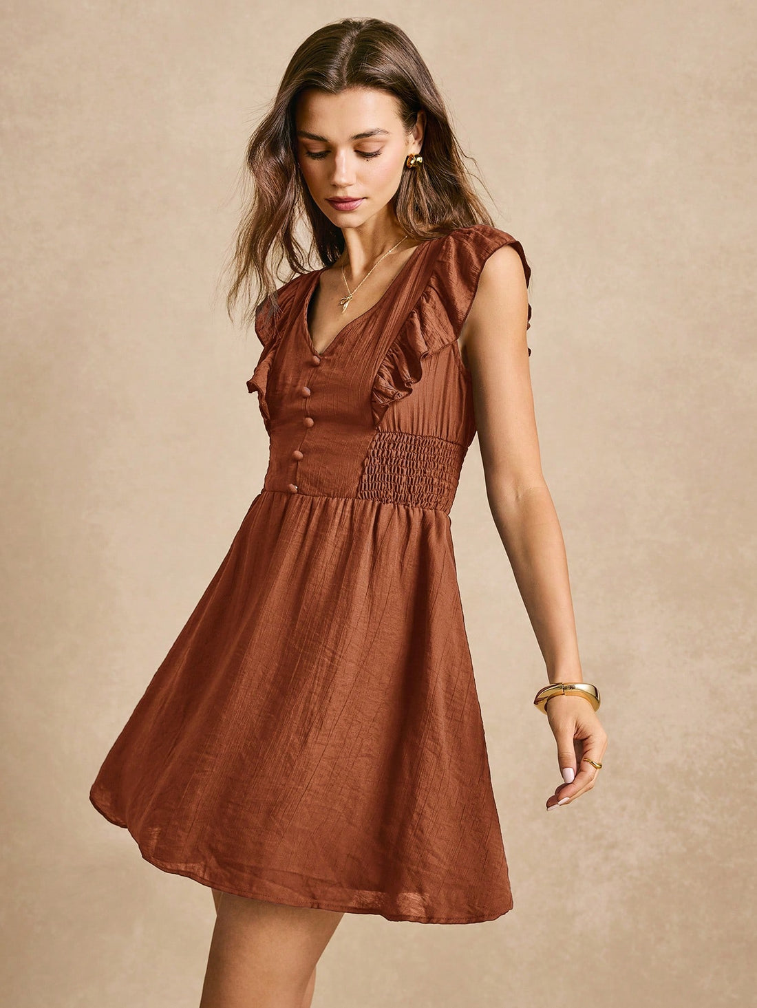 This dress is all about the details! With a chic A-line cut and ruffle trim, it's both stylish and playful. The button front adds some extra charm. Perfect for any occasion, this dress will have you feeling confident and fabulous.