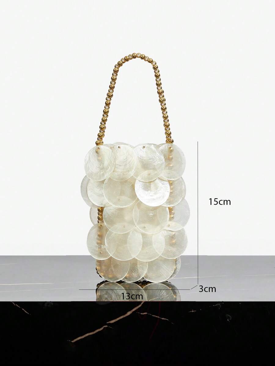 Cream shell paillette handbag with satin liner and gold rope closure