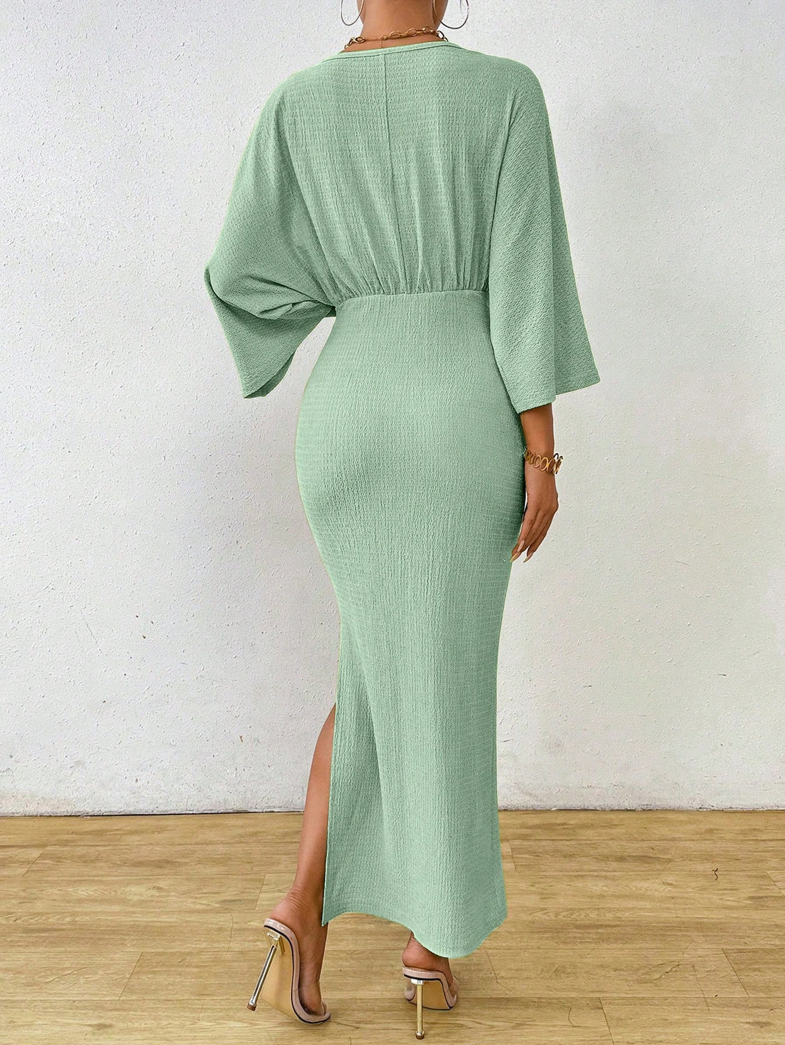 Look chic and feel comfortable in our Elegant Solid Color Bodycon Dress. Featuring a flattering waist knot and stylish batwing sleeves, this dress is perfect for any occasion. Say goodbye to boring outfits and hello to a playful and trendy look!