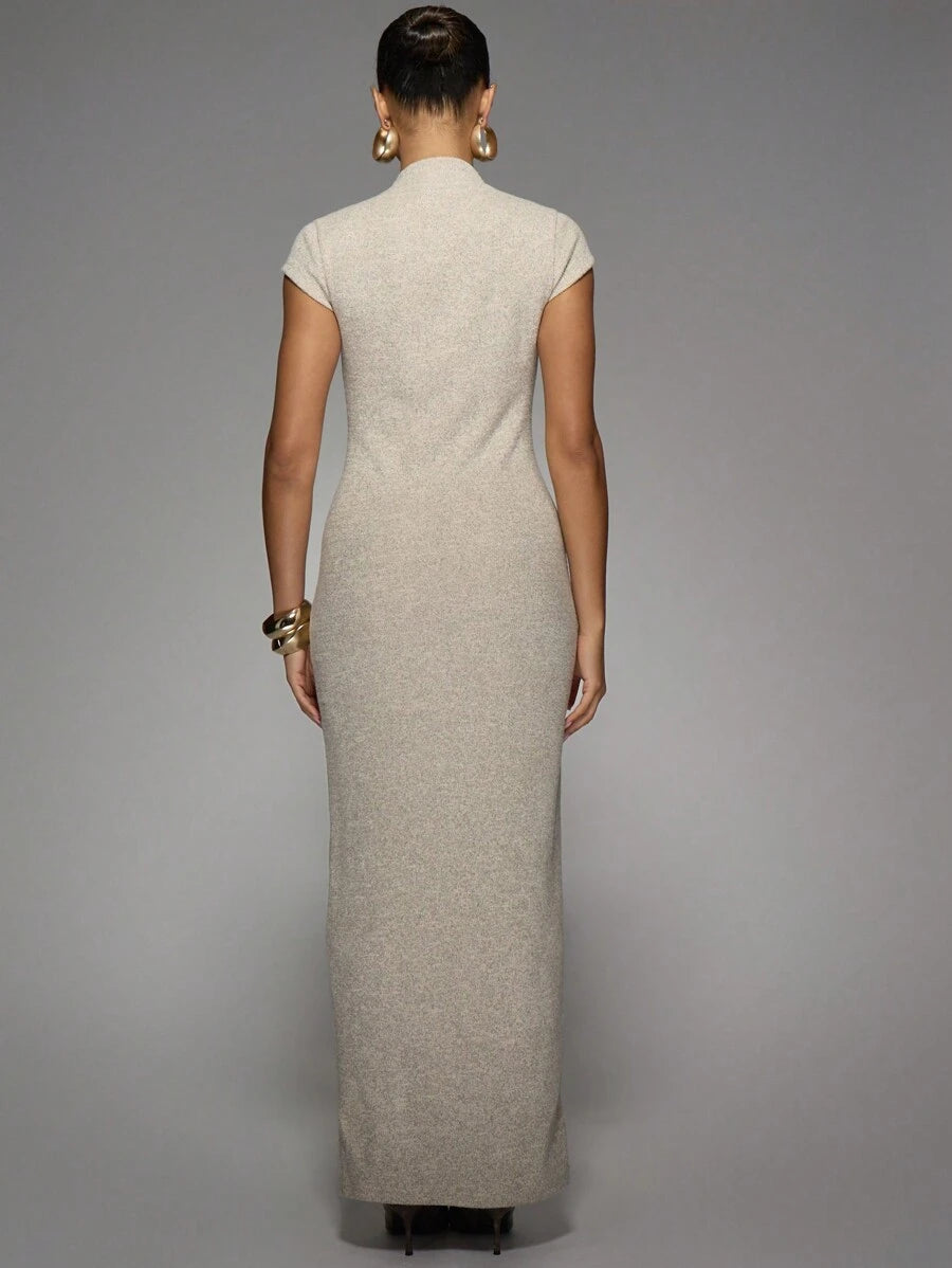 Step out in style with this chic midaxi dress featuring a sleek mock neck and a flirty side slit. Designed to turn heads at cocktail parties and weddings, it perfectly blends elegance with a hint of sass. The comfortable fit lets you dance the night away while keeping your look effortlessly polished.