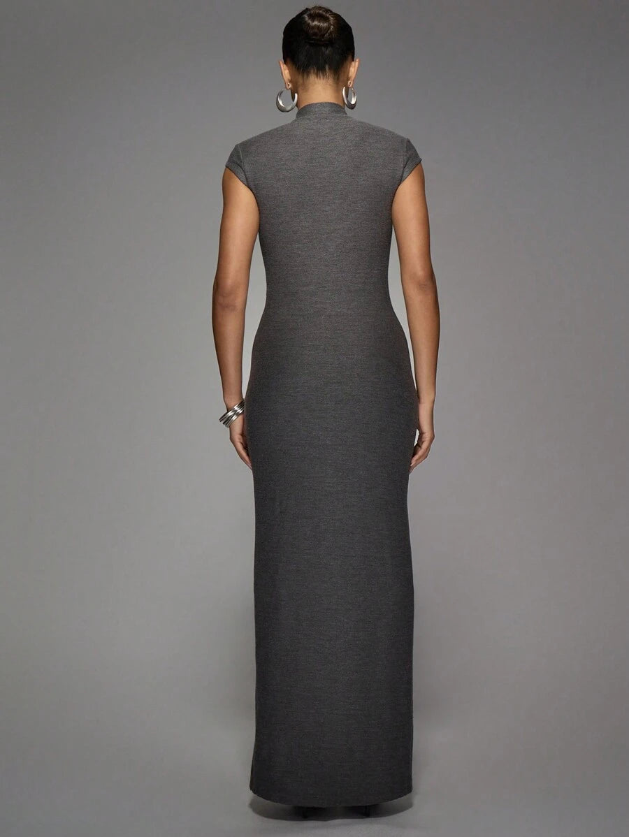 Step out in style with the Elegan Button-Down Maxi Dress. This sleeveless gown features a daring split and button-down front, perfect for turning heads at weddings or lively parties. Its flowing silhouette combines comfort and flair, making every move feel effortlessly chic and fun. Embrace elegance with a cheeky twist!