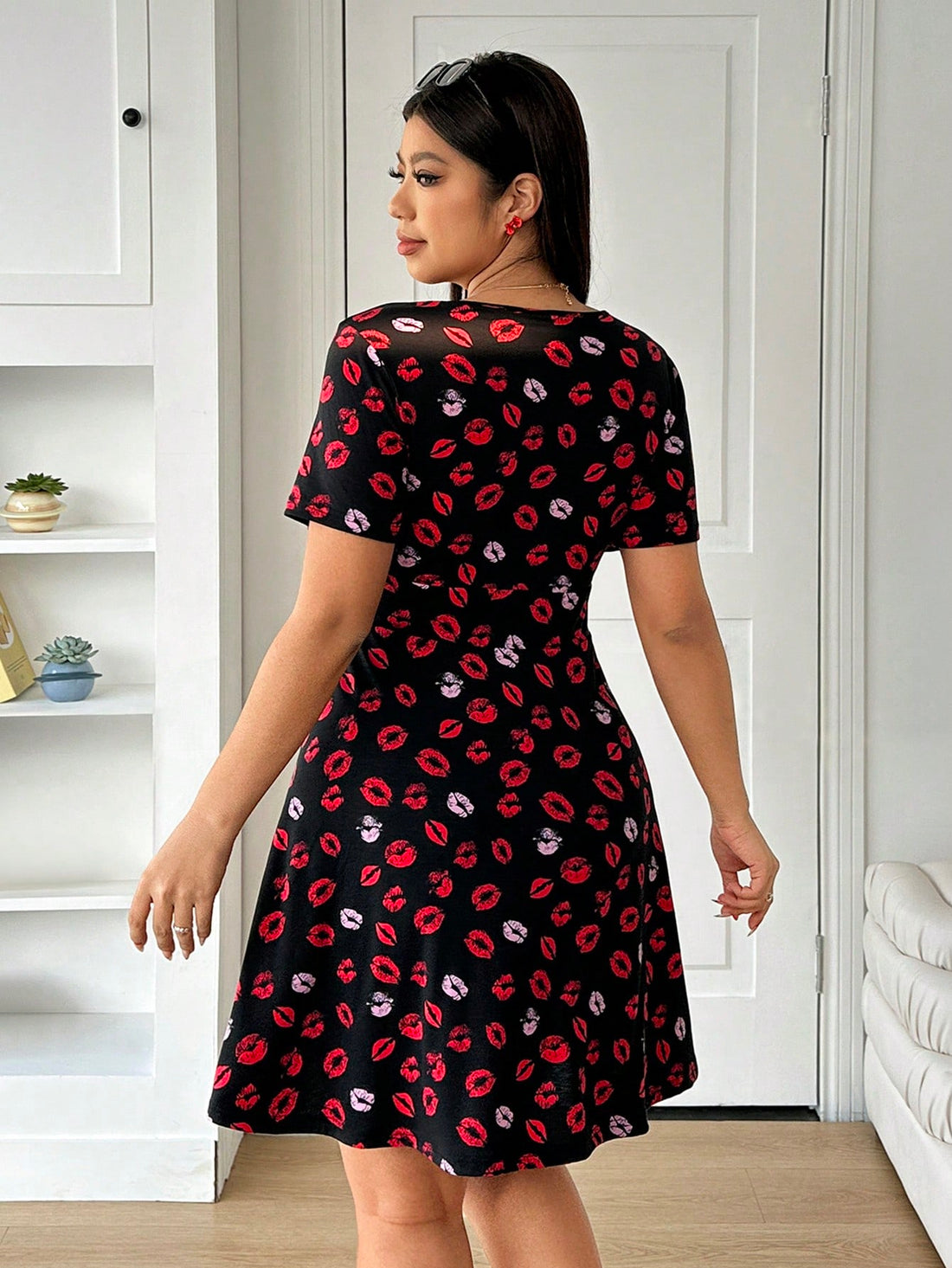 Get ready for a romantic night out in our Valentine's Day-ready dress! With a flattering V-neck and playful lip print, this dress is perfect for plus size women looking to make a statement. Impress your date and show off your unique style with this dress.