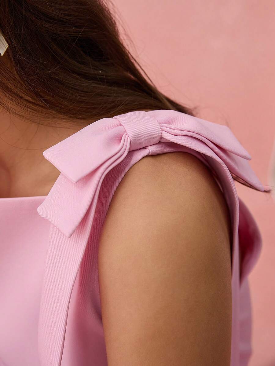 Get chic this summer with our Pink Bow Sleeveless Mini Dress! Perfect for romantic outings and special occasions, this dress features a flirty bow detail that adds a touch of whimsy. So why not add a little romance to your wardrobe? (And a little quirkiness too!)