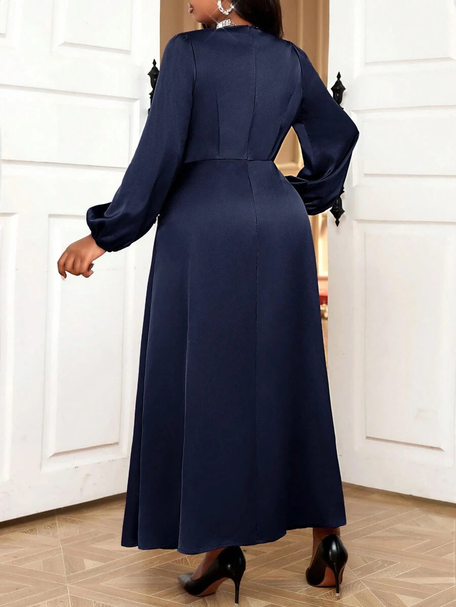 Slip into sophistication with this stunning purple satin dress that's ready to turn heads at any autumn or winter gathering. The luxurious woven satin fabric drapes beautifully while the flattering V-neckline adds an elegant touch. Designed with plus-size curves in mind, this dress celebrates your style with confidence and comfort. Perfect for holiday parties, special dinners, or whenever you want to feel absolutely fabulous. Make a statement in rich, jewel-toned purple that works beautifully against any sk