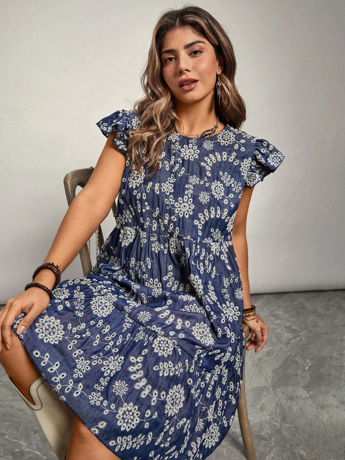 Flaunt your curves with this playful and stylish Floral Embroidery Ruffle Cap Sleeve Midi Dress for Plus Size Women. The intricate embroidery and feminine ruffle details add a touch of whimsy to this must-have dress. Perfect for any occasion, it's sure to turn heads and make you feel confident and beautiful.