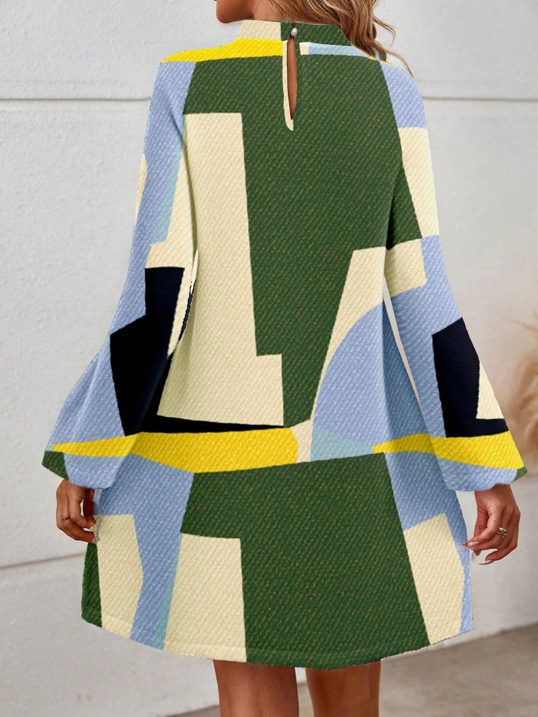 Upgrade your wardrobe with this chic and playful A-line dress featuring multiple elements and puff sleeves. Step out in style and stand out from the crowd with this unique and stylish piece. Perfect for any occasion, from casual outings to formal events. You'll surely make a statement in this dress!