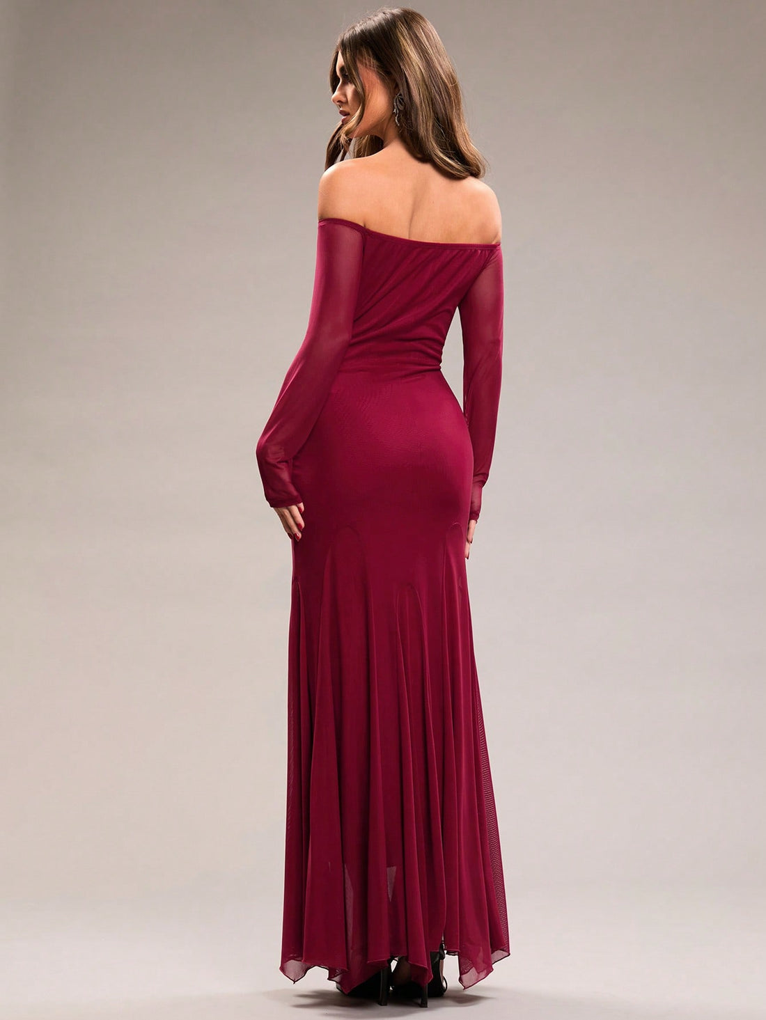 Celebrate Valentine's Day in style with this elegant burgundy maxi dress! The off-shoulder design and mesh long sleeves add a touch of romance, while the fishtail hem creates a flattering silhouette. Perfect for a classy and memorable date night.