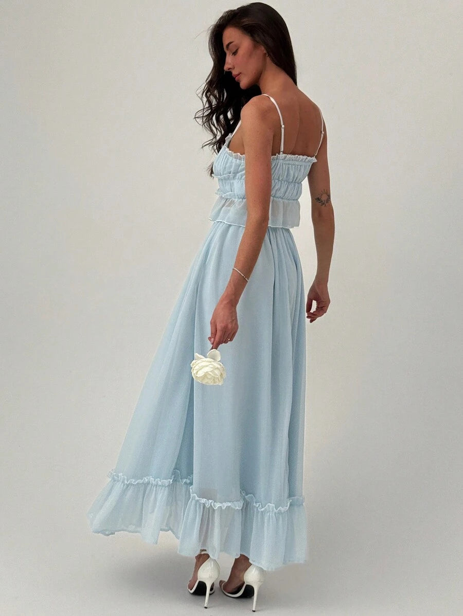 Turn heads on your next getaway with this flirty two-piece set designed for romance and adventure. The silky camisole features eye-catching contrast detailing that pairs perfectly with a playful ruffle skirt, creating an effortlessly chic look. Whether you're dressing up for a sunset dinner or exploring charming coastal towns, this set delivers vacation vibes with undeniable style. Mix, match, or wear together—versatility meets elegance in every wear.