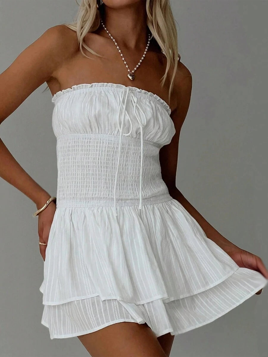 Fresh off the runway, this strapless and backless dress is perfect for the hottest summer nights. The pleated design adds movement and texture, while the mini length keeps it trendy and fun. Perfect for a night out at the club or a chic summer event.