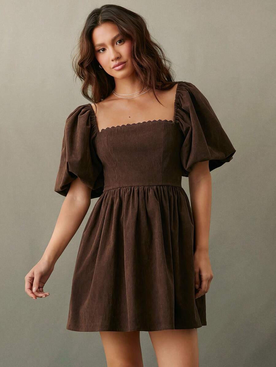 Saddle up in style with this chic cowgirl corduroy mini dress, designed for those who love country vibes with a modern twist. Featuring charming puff sleeves and a flattering silhouette, this dress captures the spirit of fall festivals and country concerts. The rich corduroy fabric offers texture and warmth, while the mini length keeps things playful and on-trend. Pair it with boots and a belt for the ultimate cowgirl look, or dress it down with sneakers for everyday wear. 