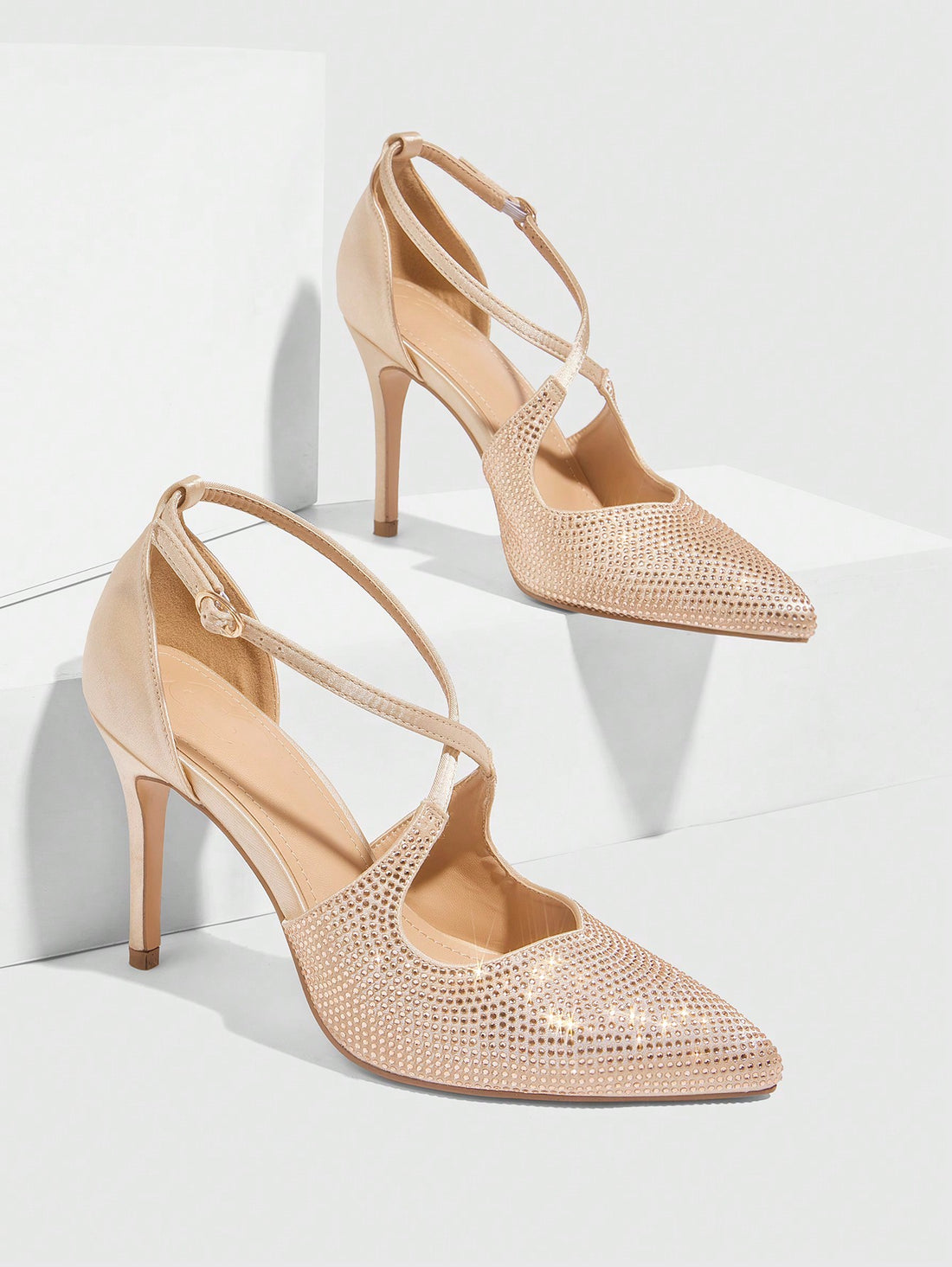 Step into the spotlight with our Radiant Elegance heels! These apricot pointed toe stilettos are adorned with sparkling rhinestone accents perfect for glamorous nights. Strut your stuff with confidence and style, leaving a trail of admiring glances (and possibly even a few lost shoes) in your wake.