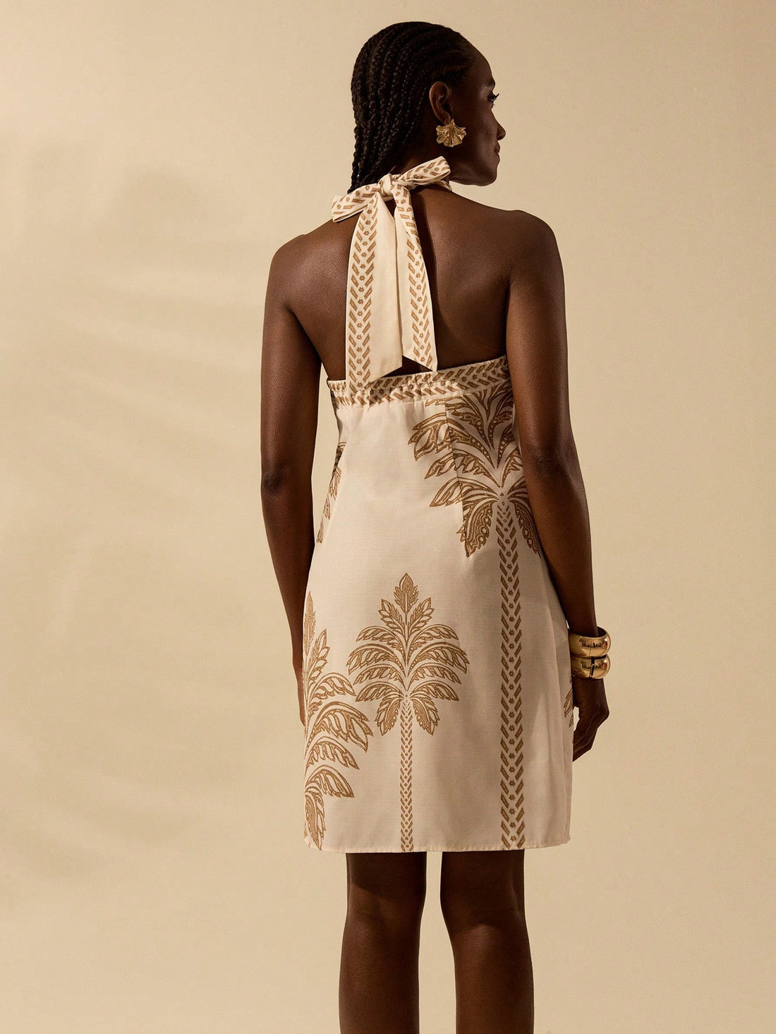 Get ready for a summer full of fun and fashion with our Boho Chic Coconut Tree Criss-Cross Halter Dress! This dress is perfect for all your beach getaways, featuring a unique criss-cross halter design and a playful coconut tree print. Stay stylish and comfortable all season long!