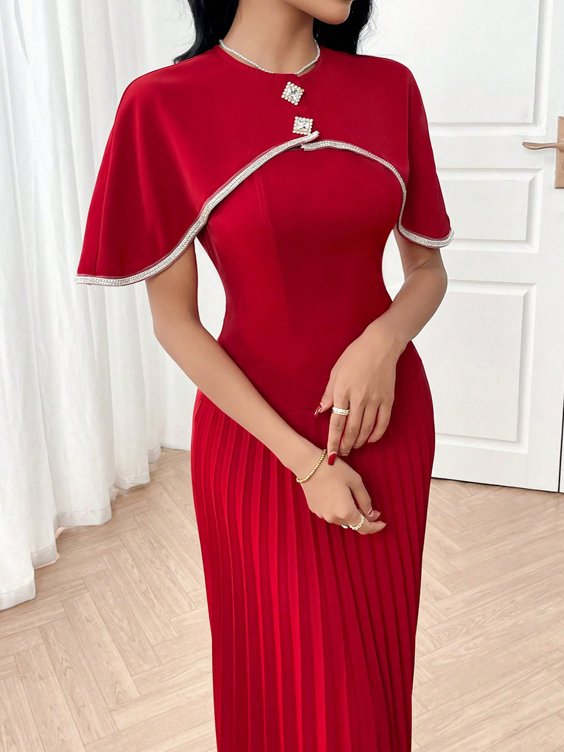 Make a statement in this stunning red dress set that combines timeless elegance with modern flair. The cascading ruffles and perfectly pleated design create movement and dimension, while the rich red hue commands attention at any evening event. Whether you're heading to a special occasion or a night out, this long dress flatters with its sophisticated silhouette and playful details. Versatile enough to dress up or down, it's the go-to piece for anyone who loves turning heads with style and grace.