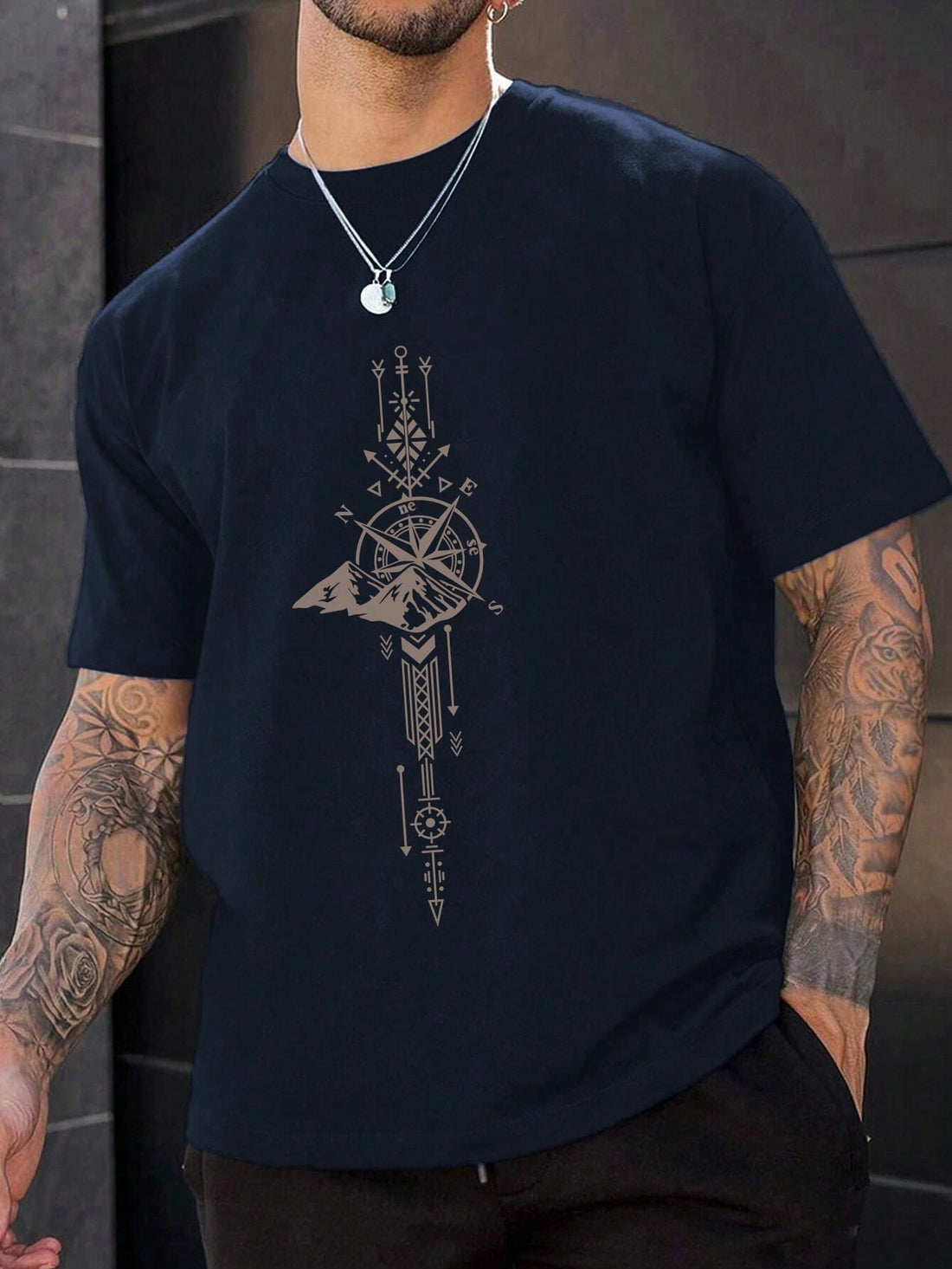 Adventure awaits with this casual and quirky Men's Compass Graphic Tee! Featuring a unique and playful compass design, this tee is perfect for those with a fun and adventurous spirit. Made for comfort and style, it's the ultimate addition to any casual outfit.